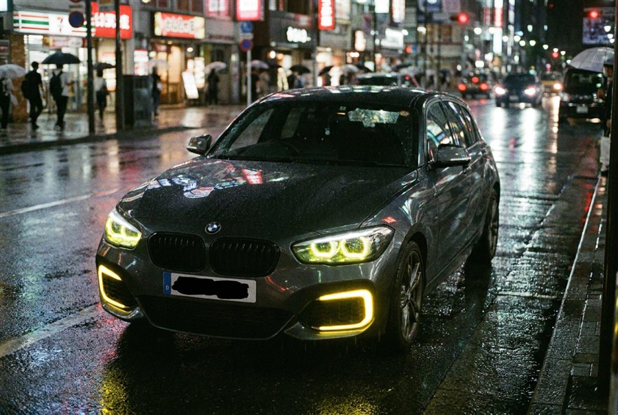 Dani's BMW on a city street at night